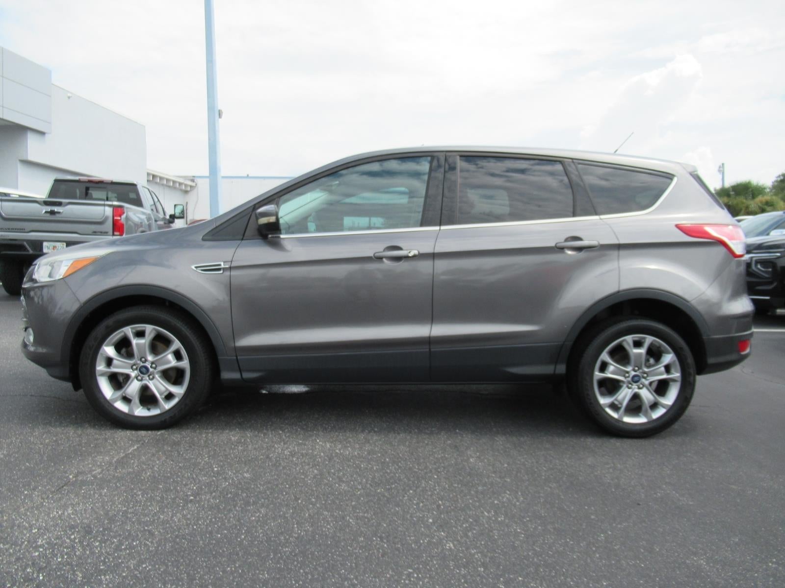 Used 2013 Ford Escape SEL with VIN 1FMCU0HX0DUD11974 for sale in Leesburg, FL