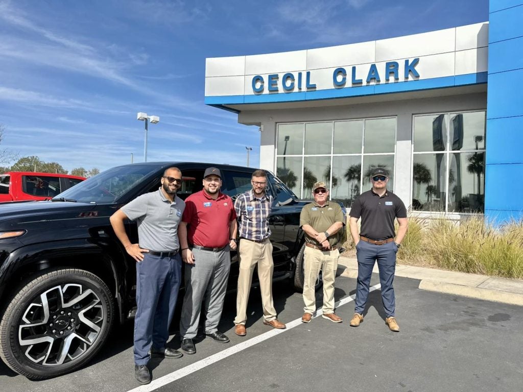 Cecil Clark Chevrolet team outside the family-owned Lake County Chevrolet dealership on US HWY 441 in Leesburg, FL
